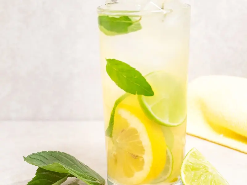 Refreshing glass of fresh lemonade with mint and ice