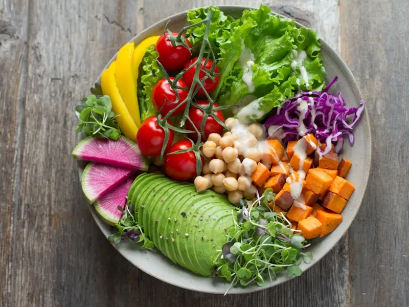 Colorful vegan buddha bowl with fresh vegetables and quinoa