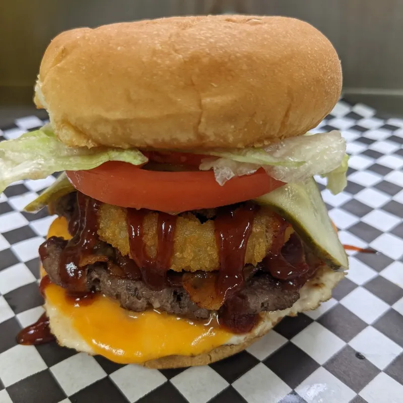 BBQ burger with onion rings and cheese