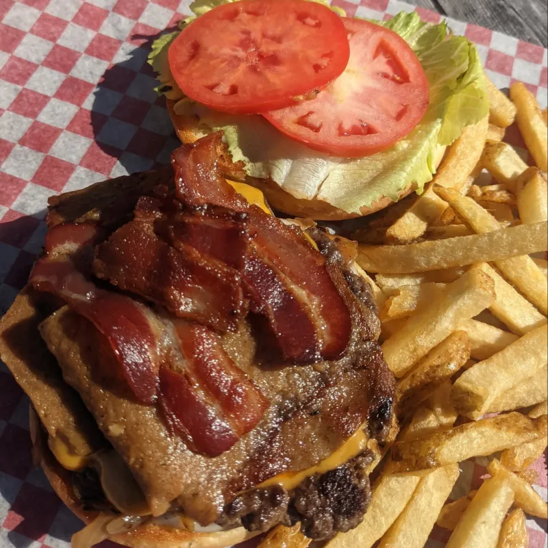 Burger with donair sauce and bacon